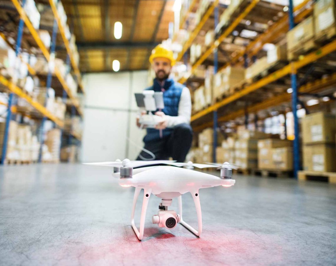 man-with-drone-in-a-warehouse-PMQEJ35.jpg