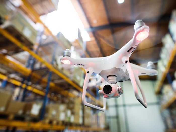 white-drone-flying-inside-the-warehouse-PQG2V8R.jpg